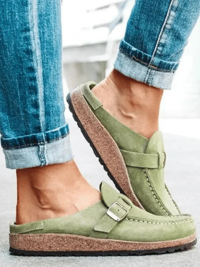 Women's Charlotte buckle clogs, comfortable slip-on shoes with adjustable strap for everyday wear.