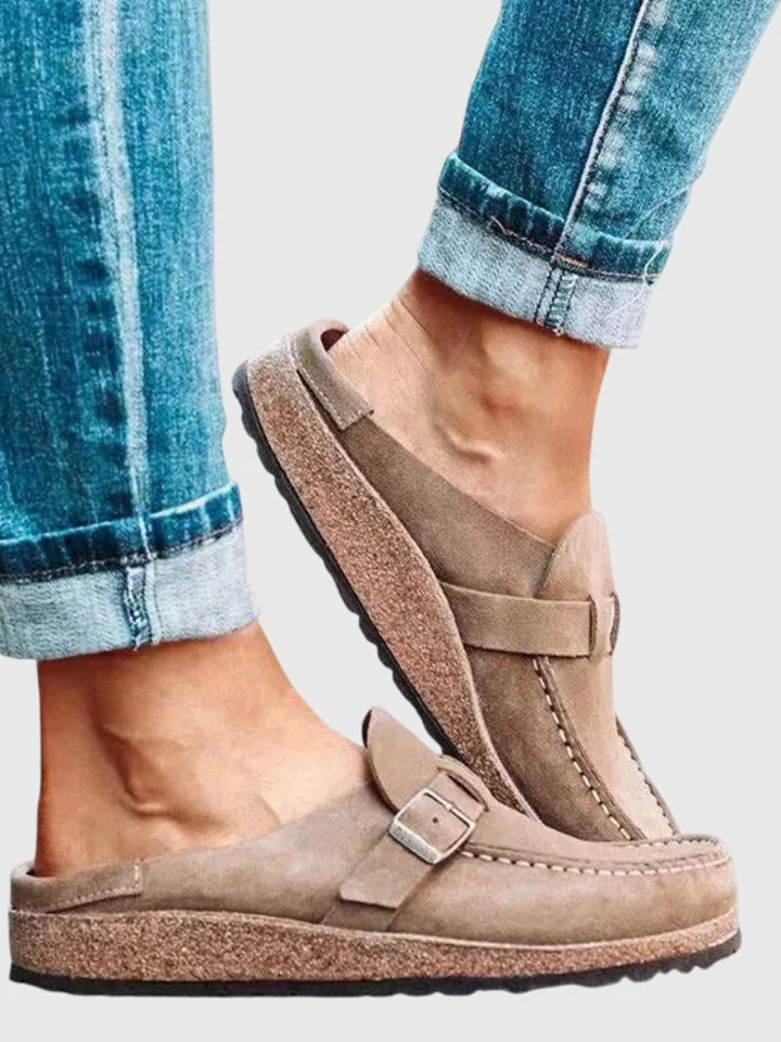 Side view of women's Charlotte buckle clogs, highlighting ergonomic comfort & trendy design for daily wear.