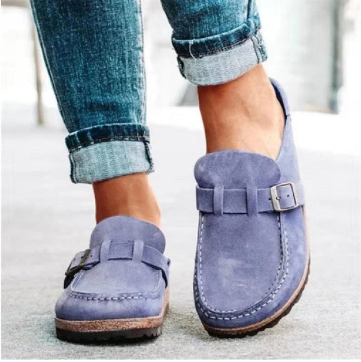 Versatile women's Charlotte buckle clogs, offering comfort & style for everyday outfits, easy slip-on.