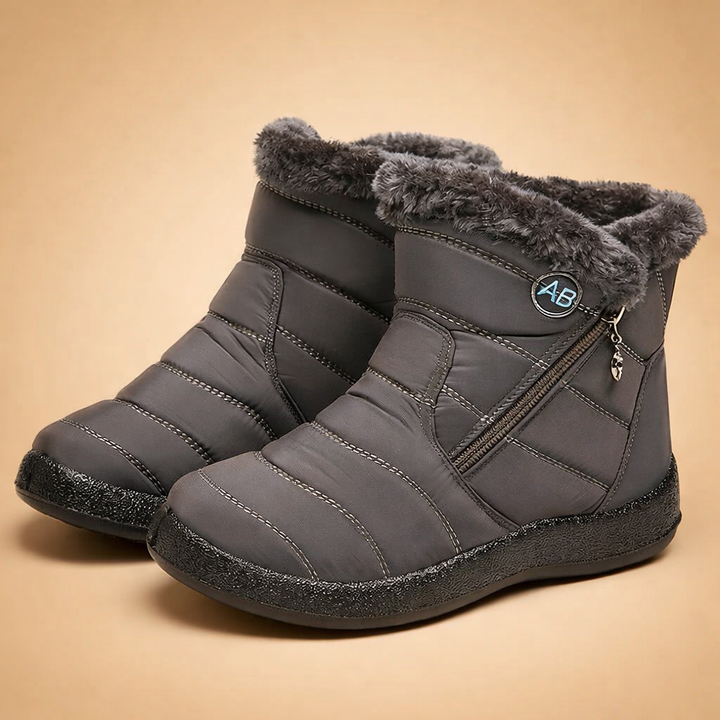 Women's Charlotte lined winter boots in tan, offering cozy comfort and stylish ankle coverage.