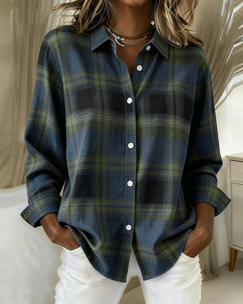 A fashionable women's top with a checked pattern and a smart shirt collar, great for spring.