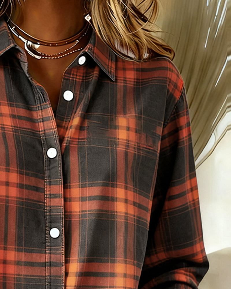 Front view of a women's patterned long sleeve shirt, featuring a classic checked design and collar.