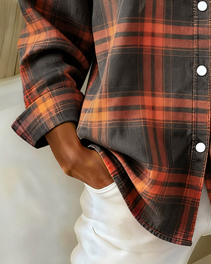 Close-up on the buckle detail of a women's checked casual wear top, highlighting autumn wear.