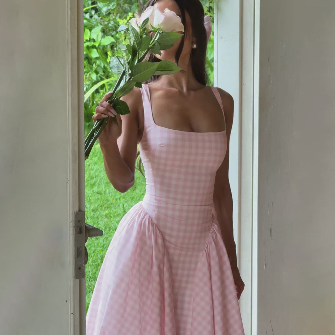Stylish women's midi dress featuring a chic checkered pattern, square neckline, and princess silhouette.