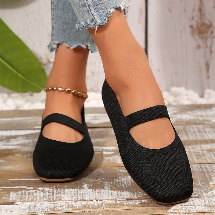 Stylish women's flats featuring a playful smiley face detail