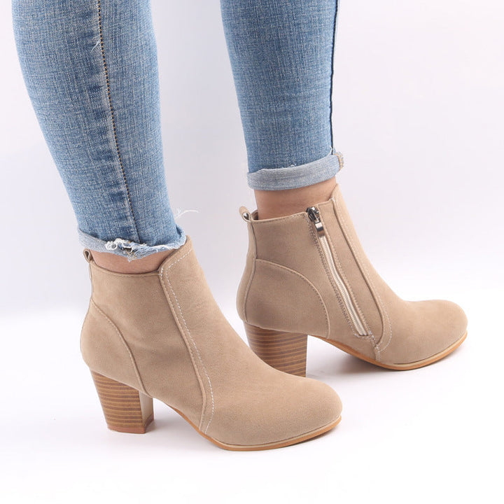 Women's chic ankle boots with chunky heel, side zip, & round toe, perfect for fall fashion.