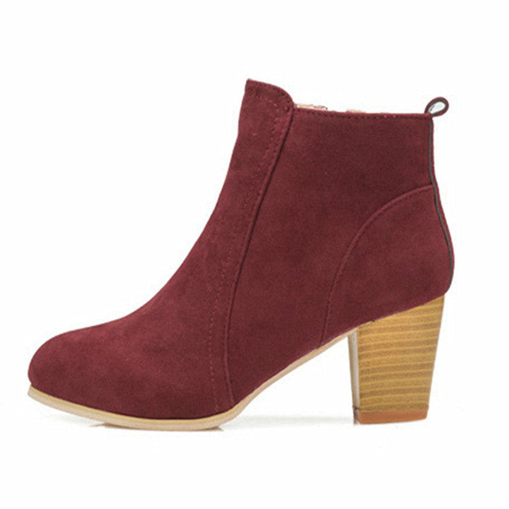 Stylish women's ankle boots featuring a sturdy chunky heel & convenient side zip, ideal for fall & winter.