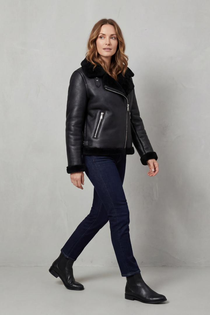 Versatile women's asymmetrical zip biker jacket in black. Edgy & stylish outerwear for winter fashion & apparel.