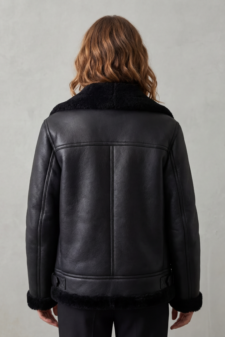 Chic women's black asymmetrical zip biker jacket. Edgy & stylish outerwear, essential for women's winter clothing.