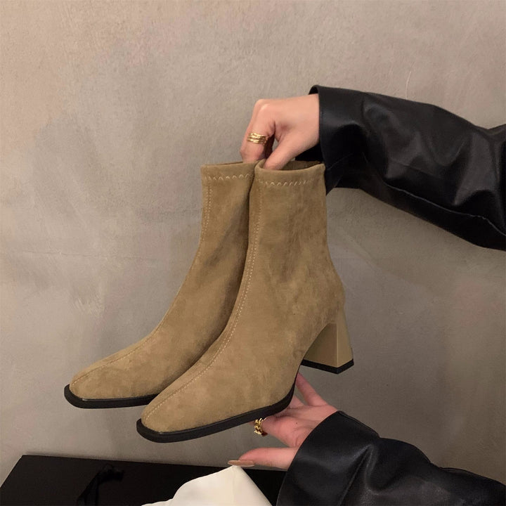 Women's block heel ankle boots offering elegant style and comfort. Chic pointed toe design, perfect for fall/winter fashion.