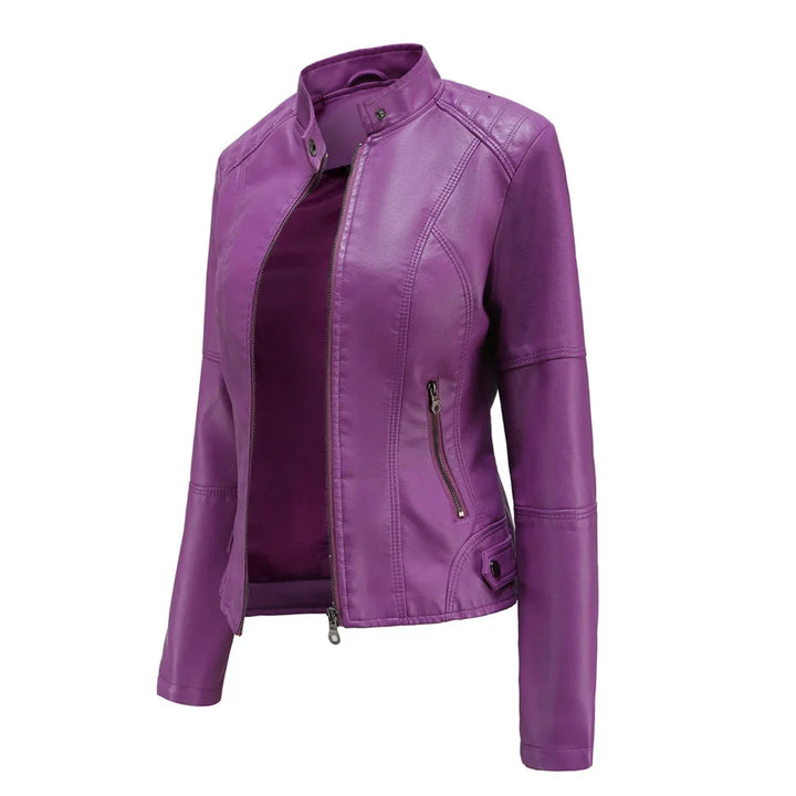 Modern women's biker-style faux leather jacket. Features a stand collar and stylish zippered pockets.