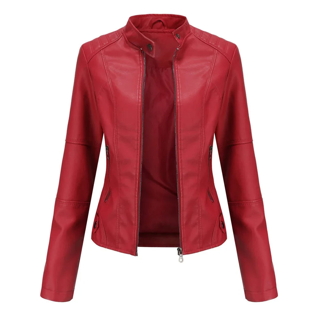 Stylish ladies' vegan leather jacket featuring a stand-up collar & practical zippered pockets for fashion.