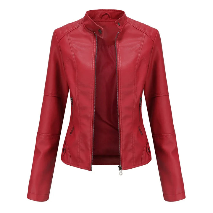 Stylish ladies' vegan leather jacket featuring a stand-up collar & practical zippered pockets for fashion.