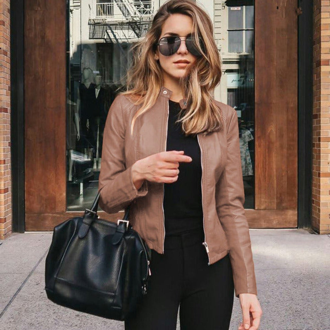 Plus size women's chic slim-fit zip-up jacket. Flattering design with rose gold hardware. Smart casual appeal.
