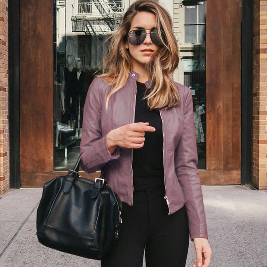 Modern women's outerwear: slim fit zip-up jacket with functional pockets & chic rose gold hardware. Everyday style.