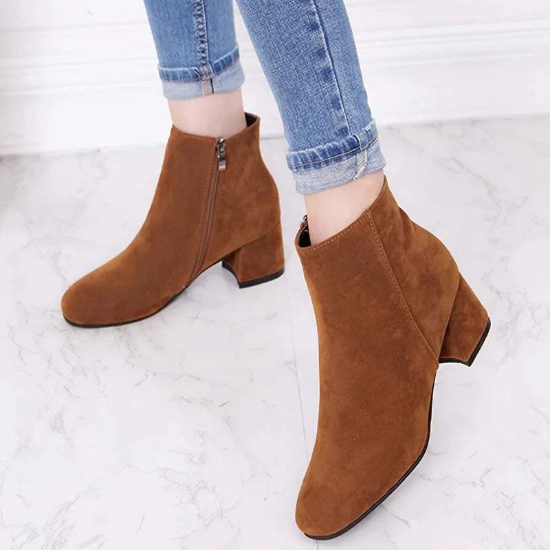 Chic women's block heel ankle boots, perfect for fall & winter fashion. Easy side zip closure.