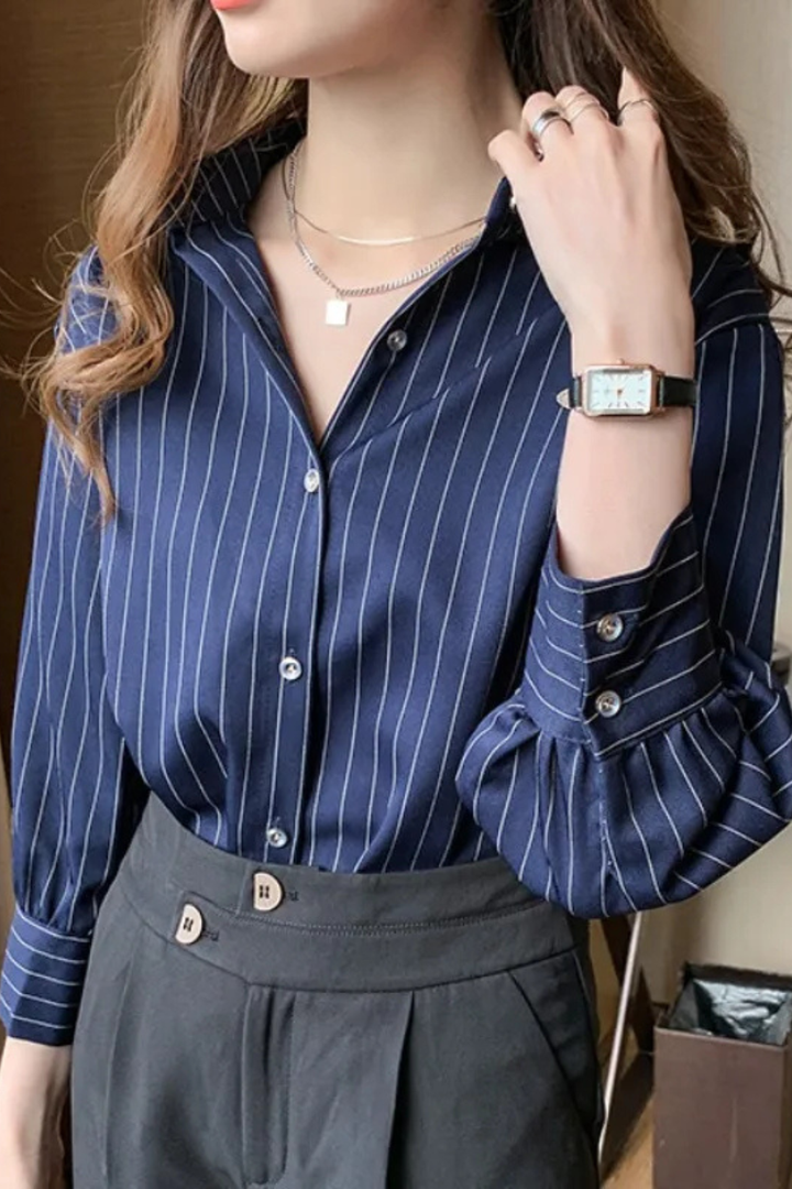Stylish women's long sleeve striped button-down shirt. Chic blue and white blouse, a classic for both casual & office.