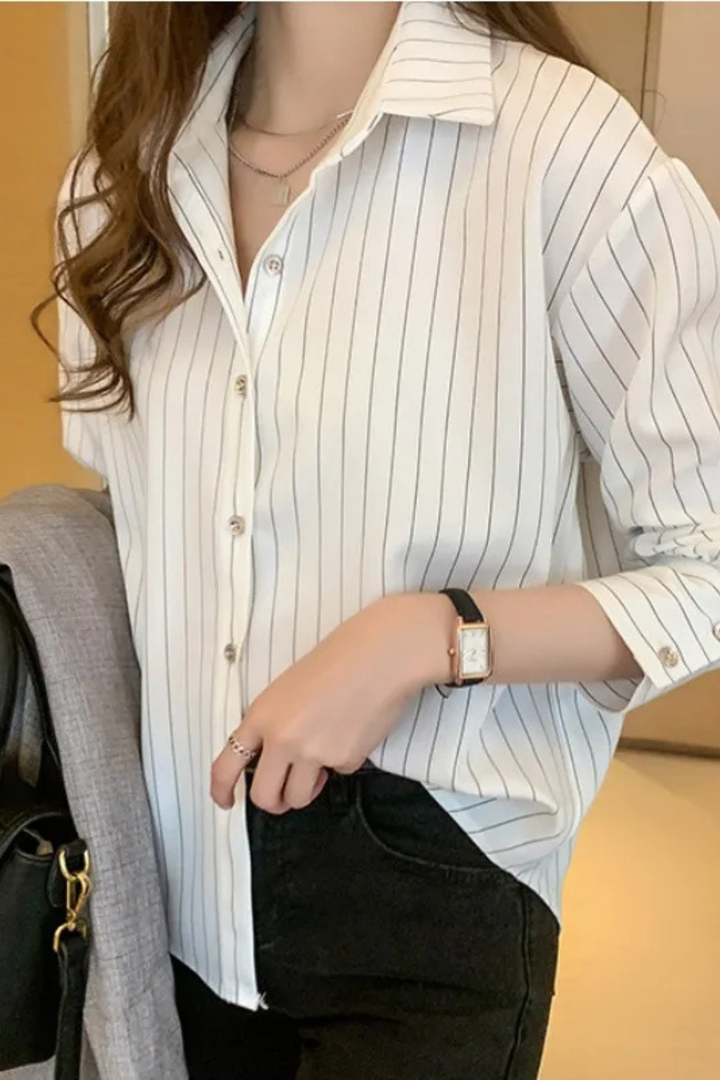 Women's classic blue & white striped button-down blouse. Versatile long sleeve shirt for work, casual, and chic outfits.