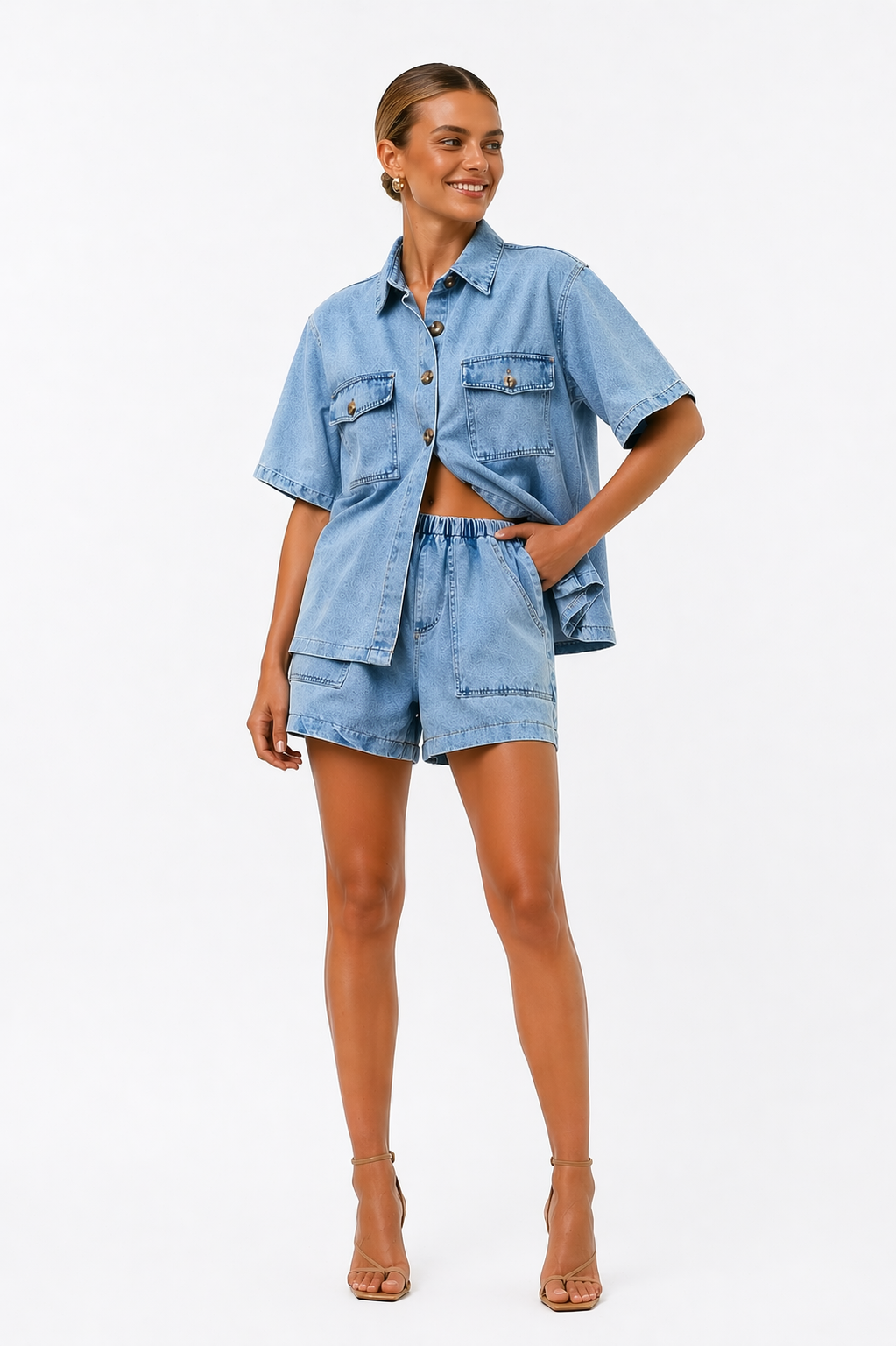 Woman wearing a stylish blue two-piece shirt and high-waist shorts co-ord set, ready for a summer outing.