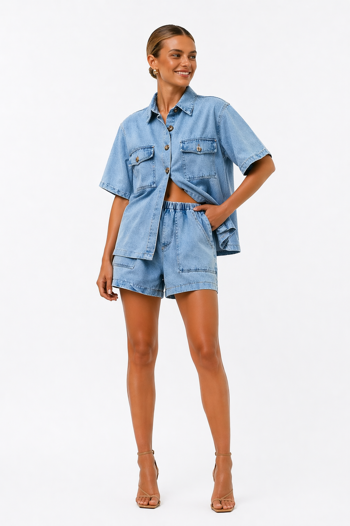 Woman wearing a stylish blue two-piece shirt and high-waist shorts co-ord set, ready for a summer outing.