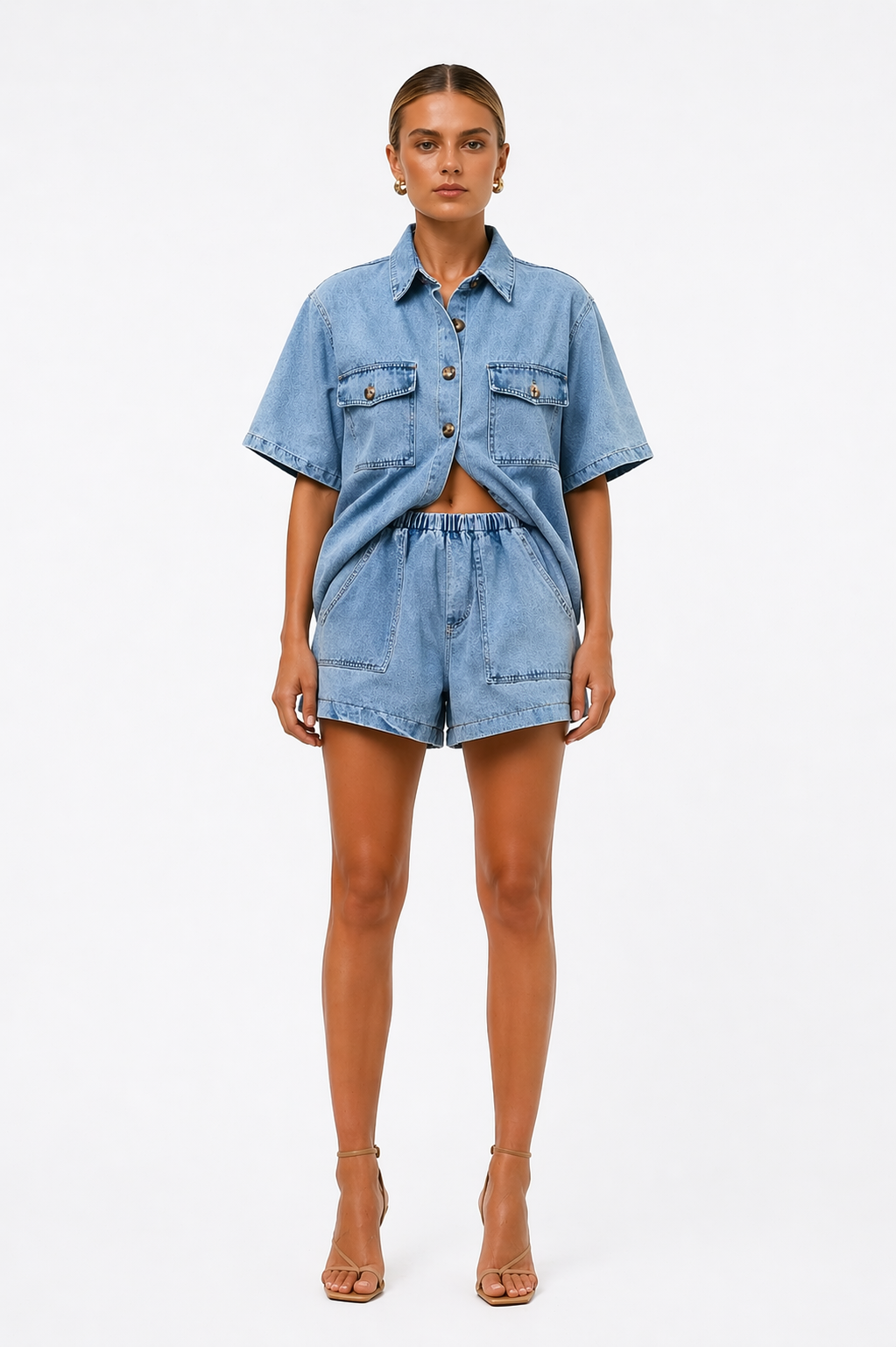 Women's blue two-piece shirt & high-waist shorts co-ord set. Chic, casual, and perfect for summer fashion.