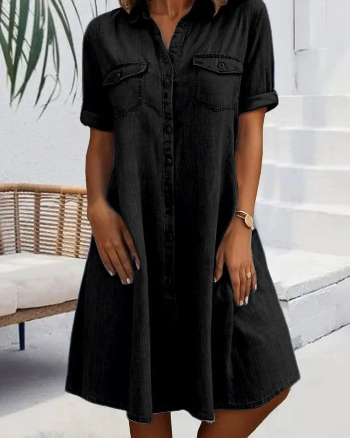 Relaxed fit women's collared shirt dress featuring a stylish button-down front & short sleeves. Versatile summer wear.