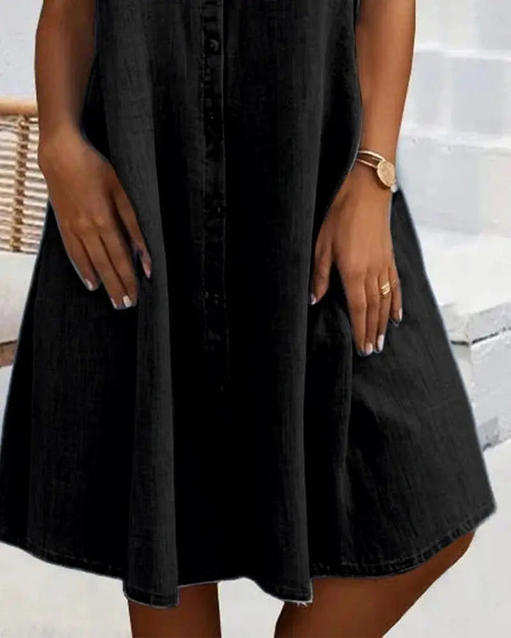 Full-length view of a women's versatile button-down shirt dress with short sleeves, great for summer casual chic.