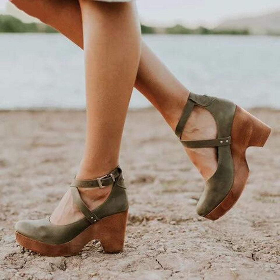 Stylish women's closed-toe wedge heels featuring a secure ankle strap for elegant and chic sandals.