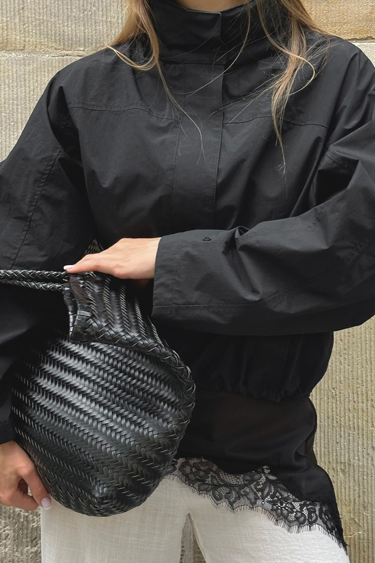 Close-up of the stylish collar on a women's lightweight windbreaker jacket