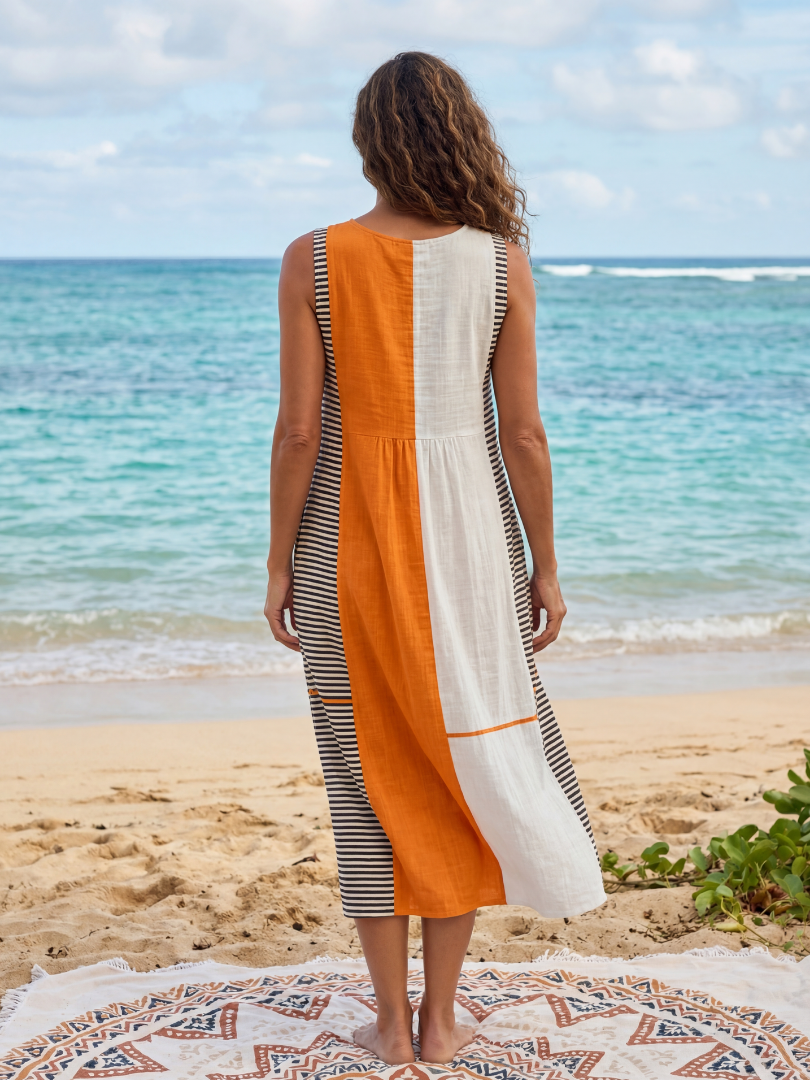 Chic sleeveless women's midi dress featuring vibrant color block stripes. Ideal for effortless summer casual and everyday wear.
