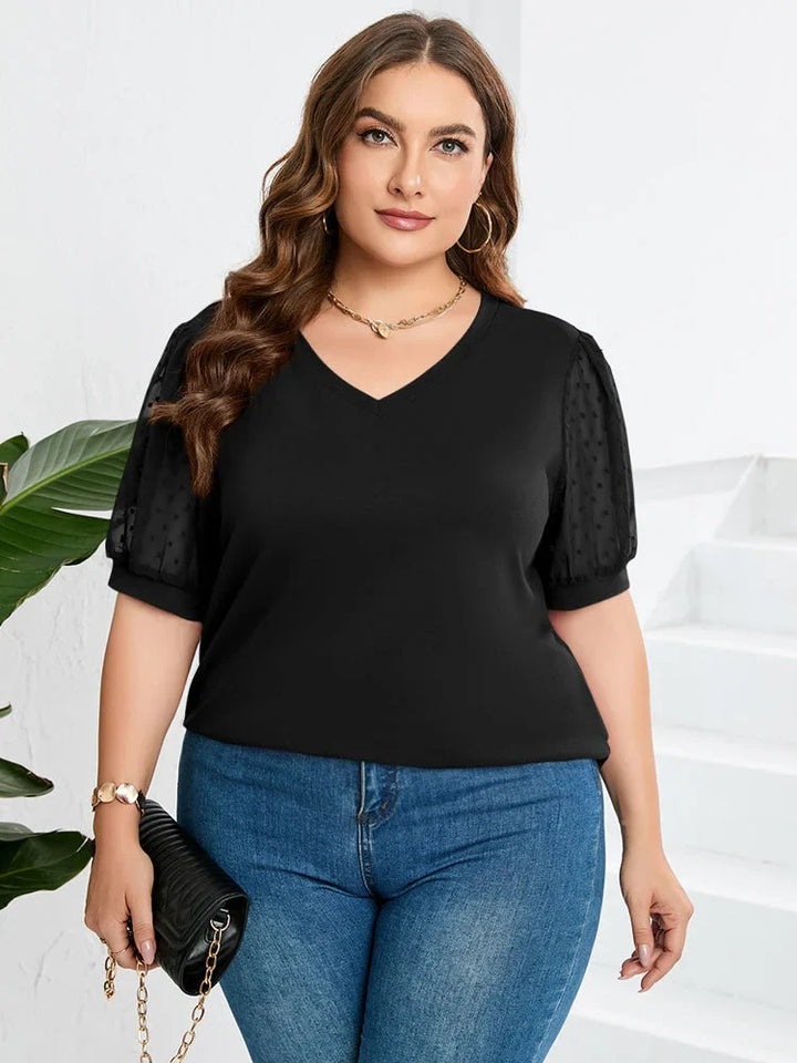 Women's chic dotted puff-sleeve V-neck blouse, elegant and versatile top.