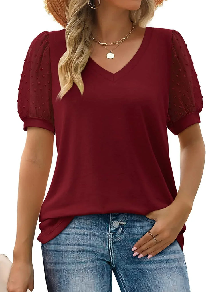 Sophisticated women's dotted puff-sleeve V-neck blouse for any occasion.