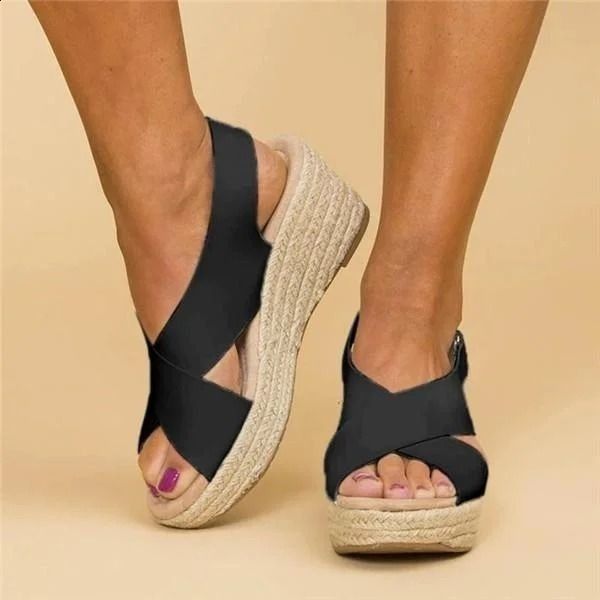 Stylish women's espadrille wedge sandals, ideal summer shoes for beach wear or casual outings. Chic open toe design.