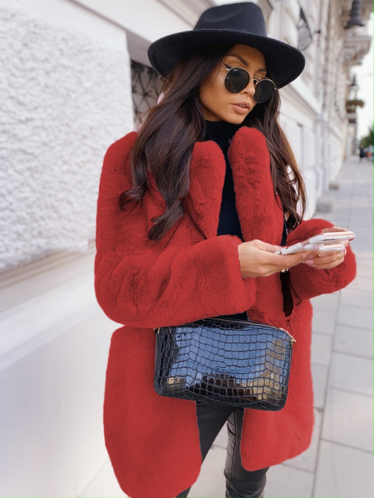 Stylish women's faux fur jacket for winter. Cozy & warm outerwear, a chic fall fashion essential.
