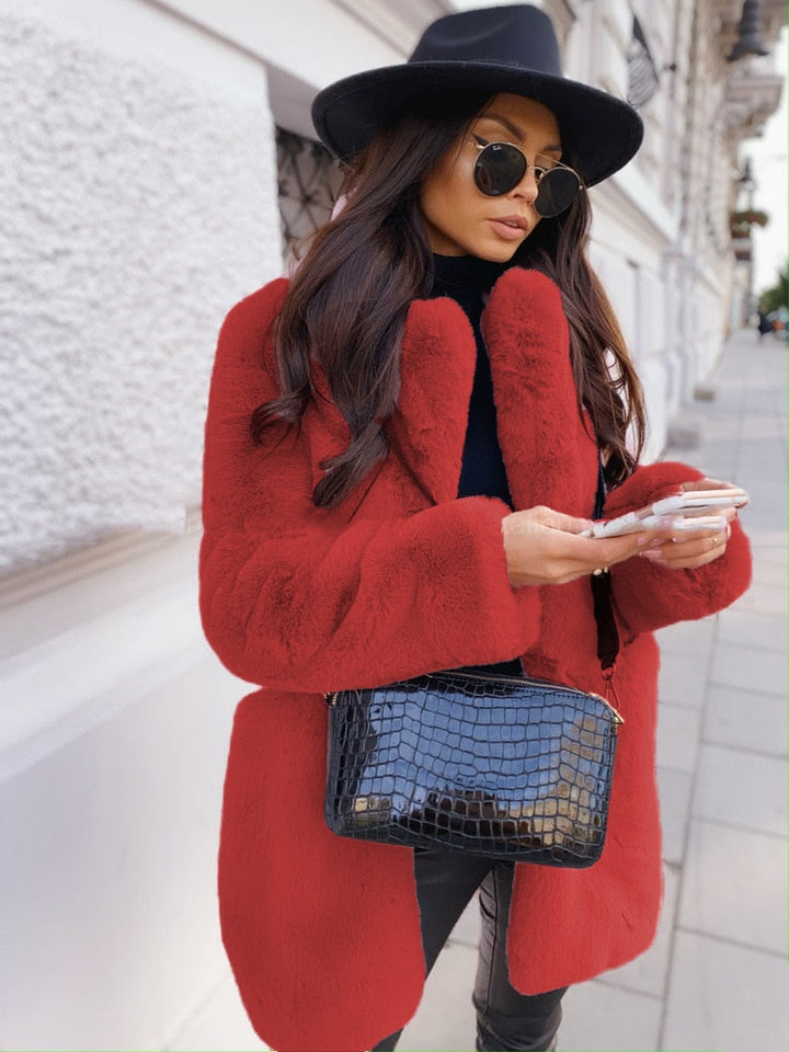 Stylish women's faux fur jacket for winter. Cozy & warm outerwear, a chic fall fashion essential.