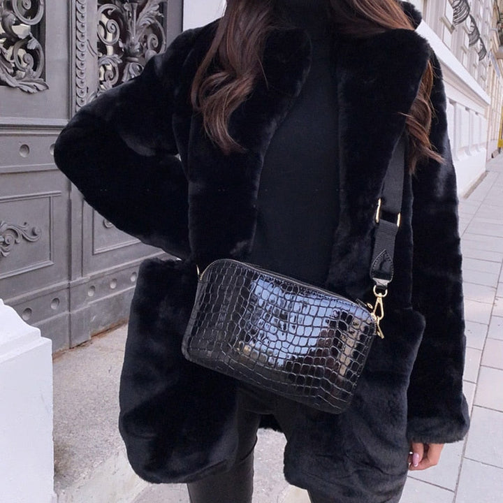 Chic women's faux fur jacket, ideal for winter. Stylish, warm, and elegant outerwear for fall fashion.