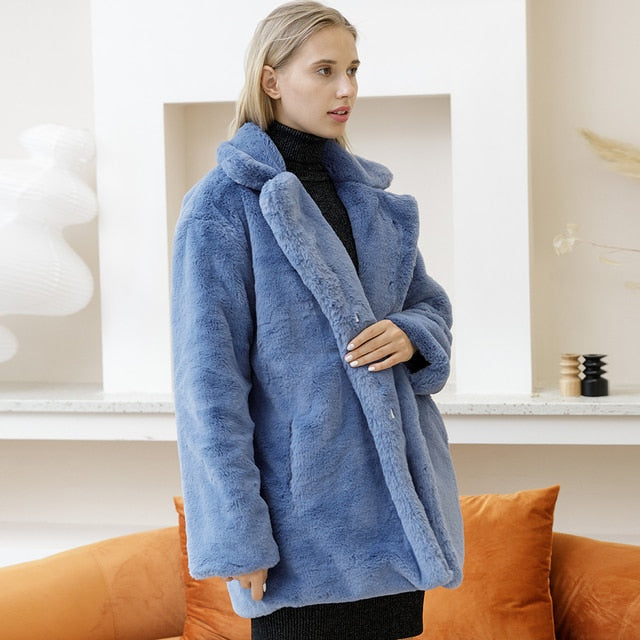 Fashionable women's faux fur jacket, offering cozy warmth. A chic and stylish winter coat.