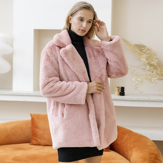 Elegant faux fur winter jacket for women. Stay warm and stylish with this chic outerwear option.