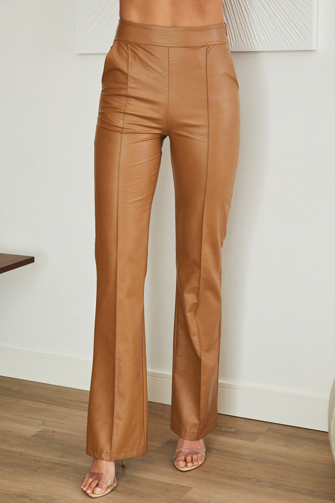 Modern women's faux leather straight leg pants with convenient side zip.