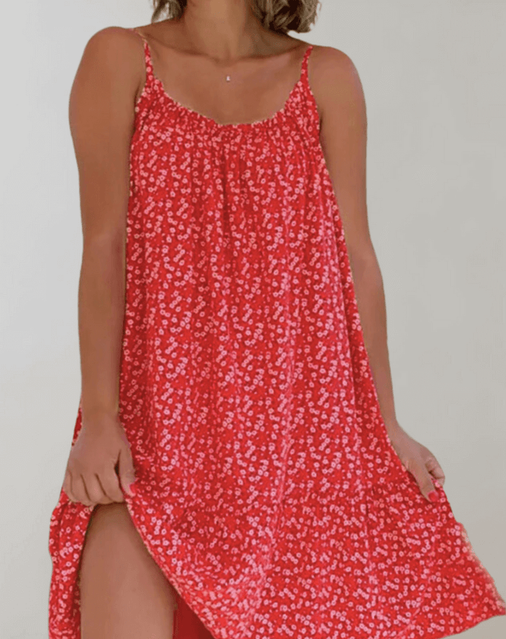 Women's vibrant floral midi summer dress, sleeveless and flowy, suitable for any elegant or casual occasion.
