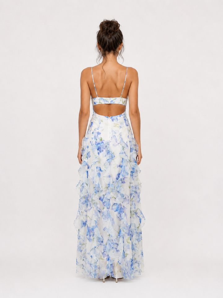 Stylish women's elegant floral print maxi dress with charming ruffle details. Ideal for sophisticated summer parties.