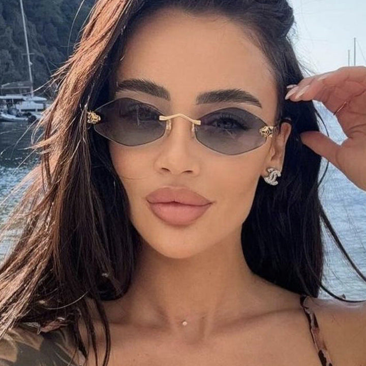 Modern geometric sunglasses for women, offering full UV protection. Features a unique double frame design.