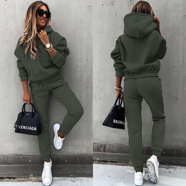 Model wearing a women's chic grey sweatshirt and jogger set, comfortable two-piece for casual style.