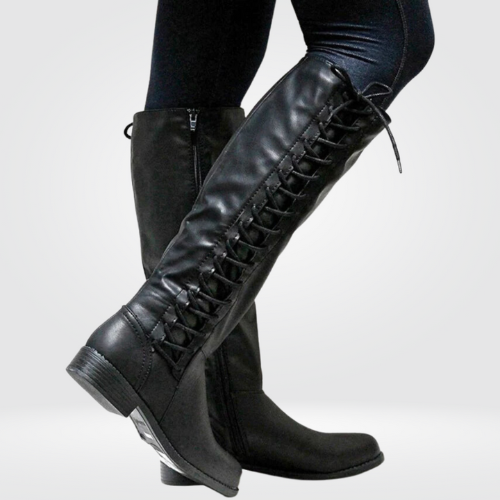 Stylish women's black knee-high lace-up boots, ideal for casual everyday wear with a touch of Western flair.