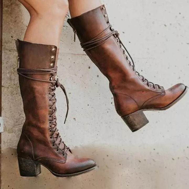 Elegant women's knee-high lace-up boots, a stylish and chic fashion statement.