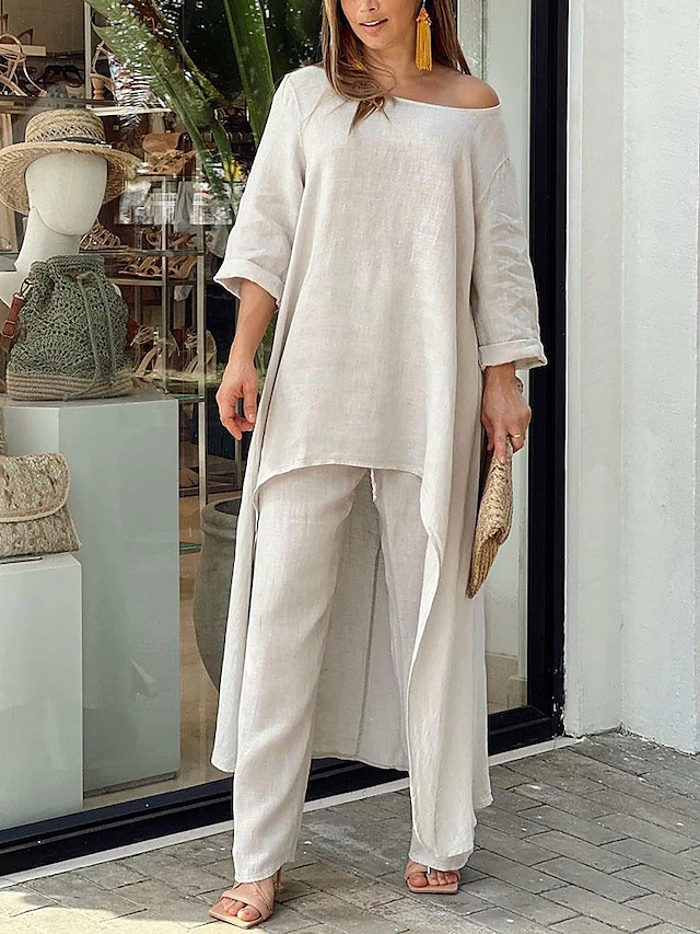 Effortless women's two-piece set: soft long-sleeve top & relaxed wide-leg pants. Stylish casual loungewear.