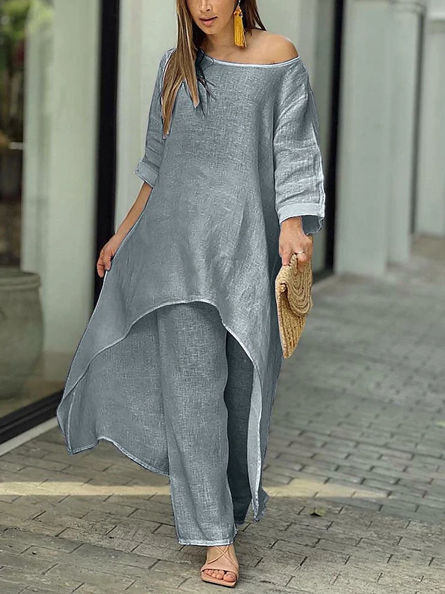 Relaxation-focused women's two-piece set. Comfortable long-sleeve top & wide-leg pants. Chic loungewear for weekends.