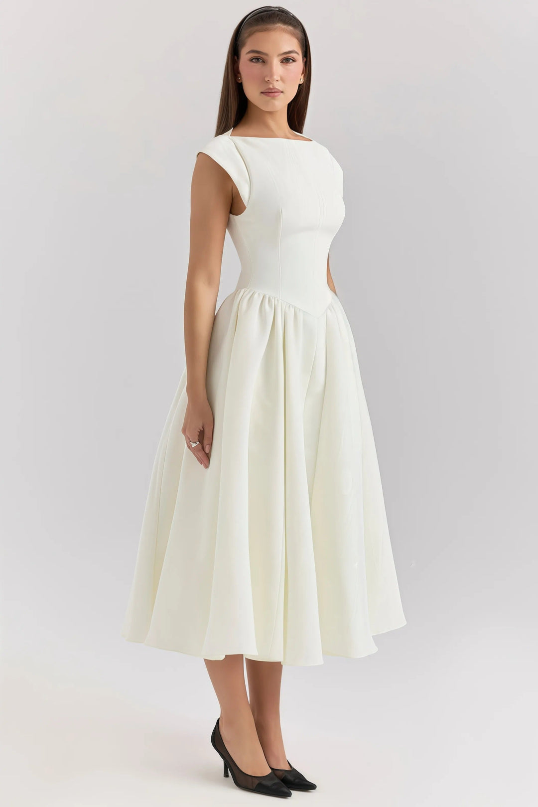 Women's chic midi dress with elegant ruffle detail, perfect for spring & summer occasions.