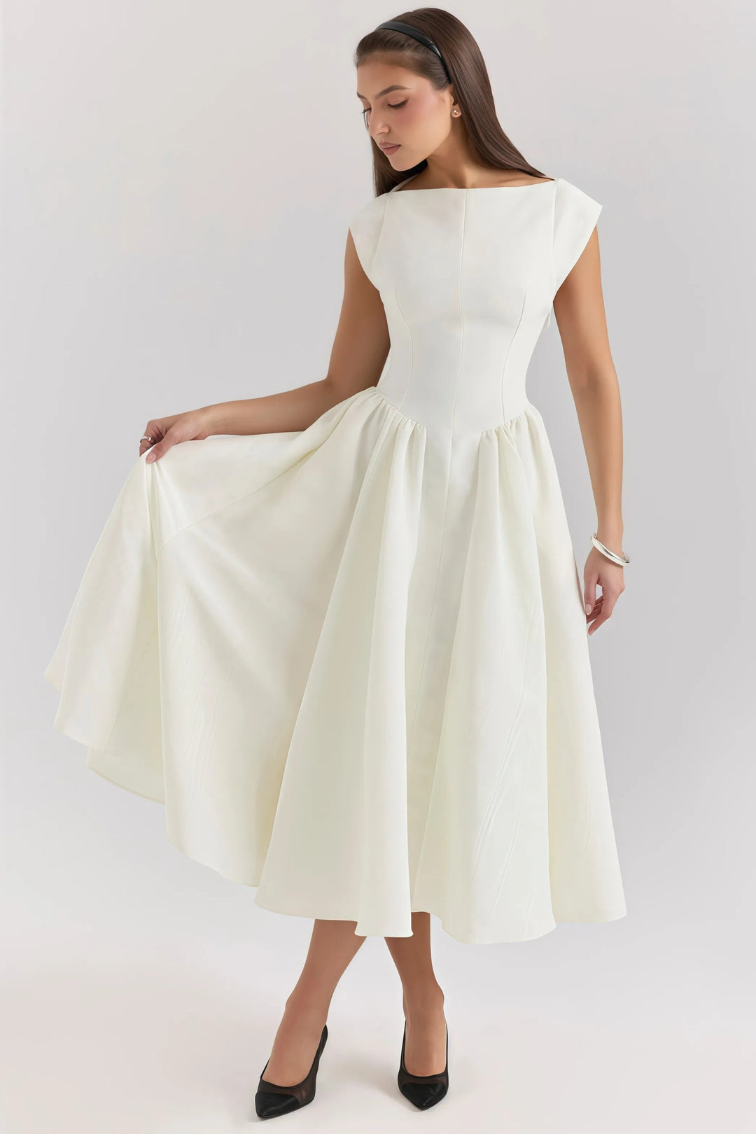 Chic women's midi dress with elegant ruffle accents, perfect for sophisticated occasion wear.