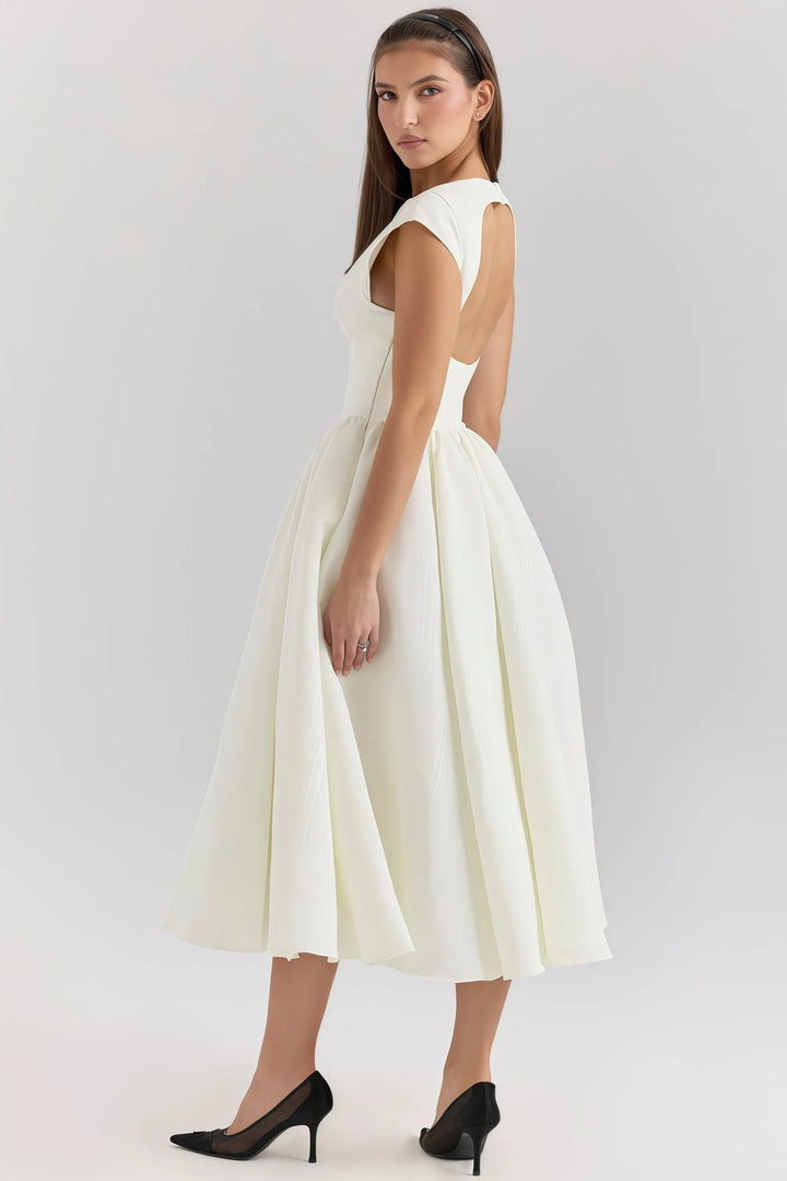 Flattering women's midi dress with elegant ruffles, a chic backless design for special occasions.
